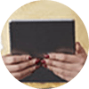 hands hold a tablet