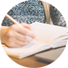 Student makes notes at a computer